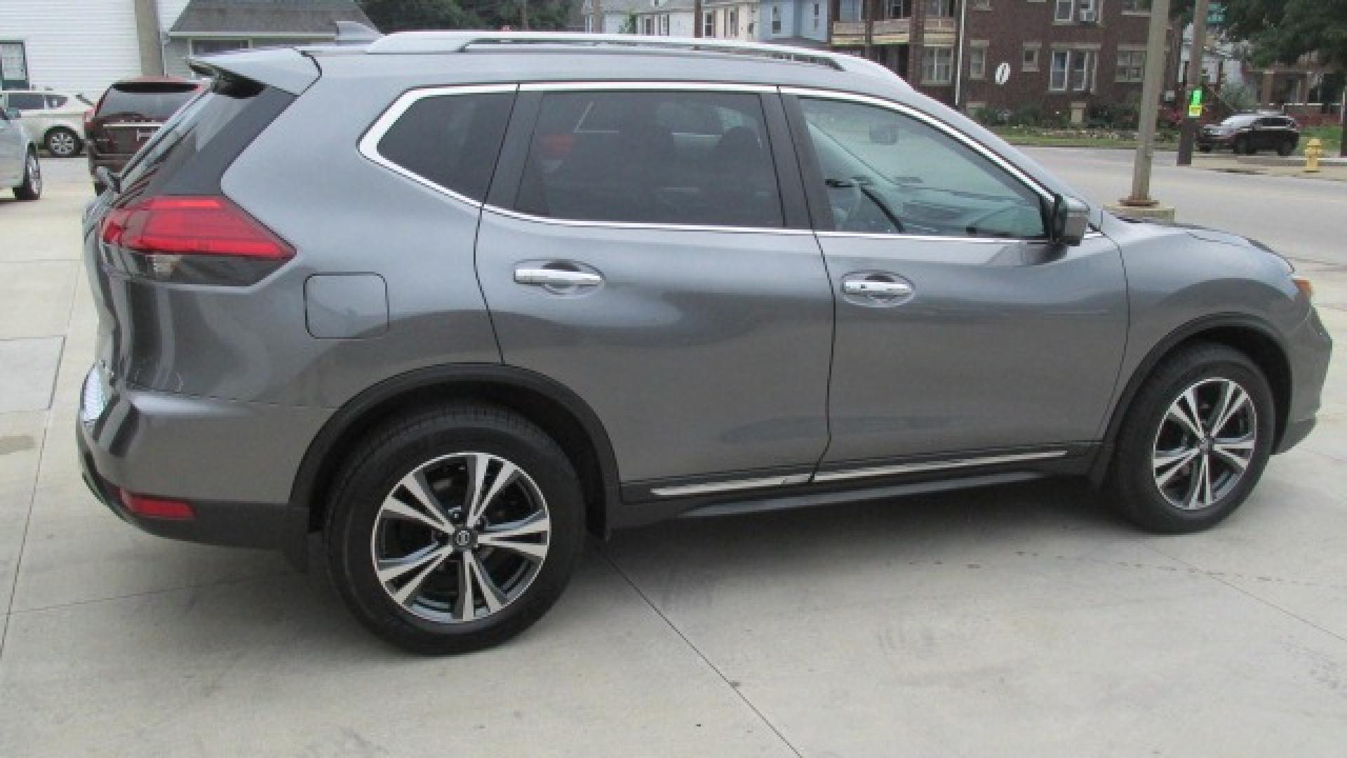 2017 Granite Metallic /Black Nissan Rogue SL (5N1AT2MV5HC) with an 2.5L L4 DOHC 16V engine, Continuously Variable Transmission transmission, located at 827 W 26th Street, Erie, PA, 16508, (814) 455-3401, 42.105431, -80.090942 - Thanks for looking at our one owner super clean new Nissan trade. This is the SL all-wheel drive with factory remote start, power seat, heated seats, leather seats, panoramic sunroof, back up camera, navigation, lane assist, Bluetooth, and lots more. A full service was just completed in our service - Photo#3