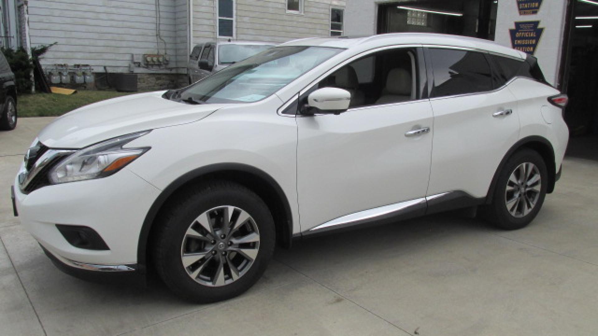 2015 Pearl White /Tan Nissan Murano SL (5N1AZ2MH0FN) with an 3.5L V6 DOHC 24V engine, Continuously Variable Transmission transmission, located at 827 W 26th Street, Erie, PA, 16508, (814) 455-3401, 42.105431, -80.090942 - Thanks for looking at our super clean nonsmoker new Nissan trade in. This is the SL model with lots of options including all wheel drive, heated leather seats, a panoramic sunroof, back up camera, navigation, factory remote start, push button start and lots more. A full service will be completed in - Photo#8