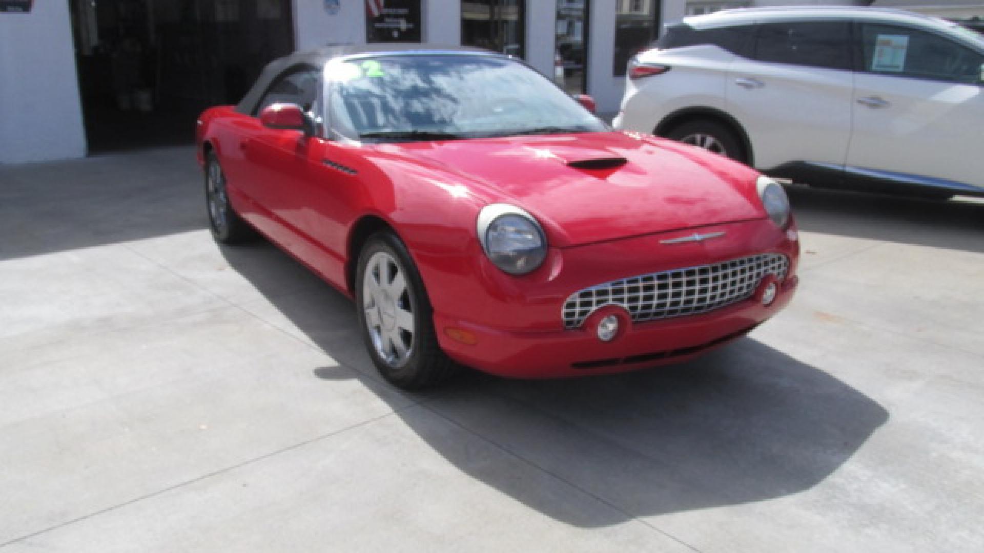 2002 Torch Red /Two Tone Red & Black Ford Thunderbird Premiunm (1FAHP60AX2Y) with an 3.9L V8 DOHC 32V engine, 5-Speed Automatic Overdrive transmission, located at 827 W 26th Street, Erie, PA, 16508, (814) 455-3401, 42.105431, -80.090942 - Thanks for looking at our super clean accident-free Florida owned new arrival. This is the Premium edition with the two-tone seats, door panels, lower dash plus leather seating, and it also comes with a like new interior. This car also comes with the hard top and stand, the parade boot, owner's manu - Photo#0