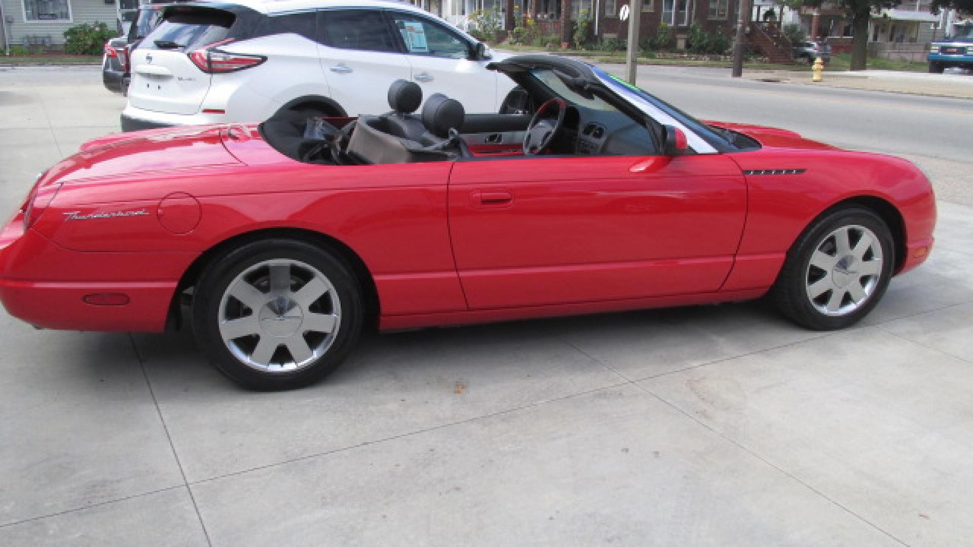 2002 Torch Red /Two Tone Red & Black Ford Thunderbird Premiunm (1FAHP60AX2Y) with an 3.9L V8 DOHC 32V engine, 5-Speed Automatic Overdrive transmission, located at 827 W 26th Street, Erie, PA, 16508, (814) 455-3401, 42.105431, -80.090942 - Thanks for looking at our super clean accident-free Florida owned new arrival. This is the Premium edition with the two-tone seats, door panels, lower dash plus leather seating, and it also comes with a like new interior. This car also comes with the hard top and stand, the parade boot, owner's manu - Photo#6