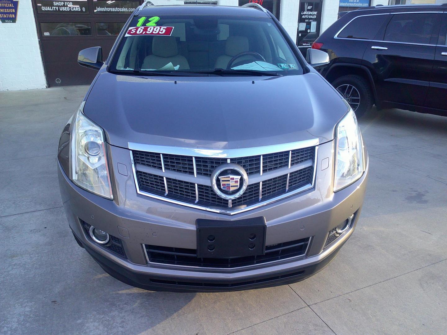 2012 Mocha Steel Metallic /Shale W / Brownstone Cadillac SRX Performance (3GYFNEE30CS) with an 3.6L V6 DOHC 24V FFV engine, 6-Speed Automatic transmission, located at 827 W 26th Street, Erie, PA, 16508, (814) 455-3401, 42.105431, -80.090942 - Thanks for looking at our two-owner accident-free recent trade in by a long-time customer who took great care of it. This is the Performance model with all wheel drive, and most all factory options. a full service was just completed in our service department with new Pa state and emissions inspectio - Photo#2