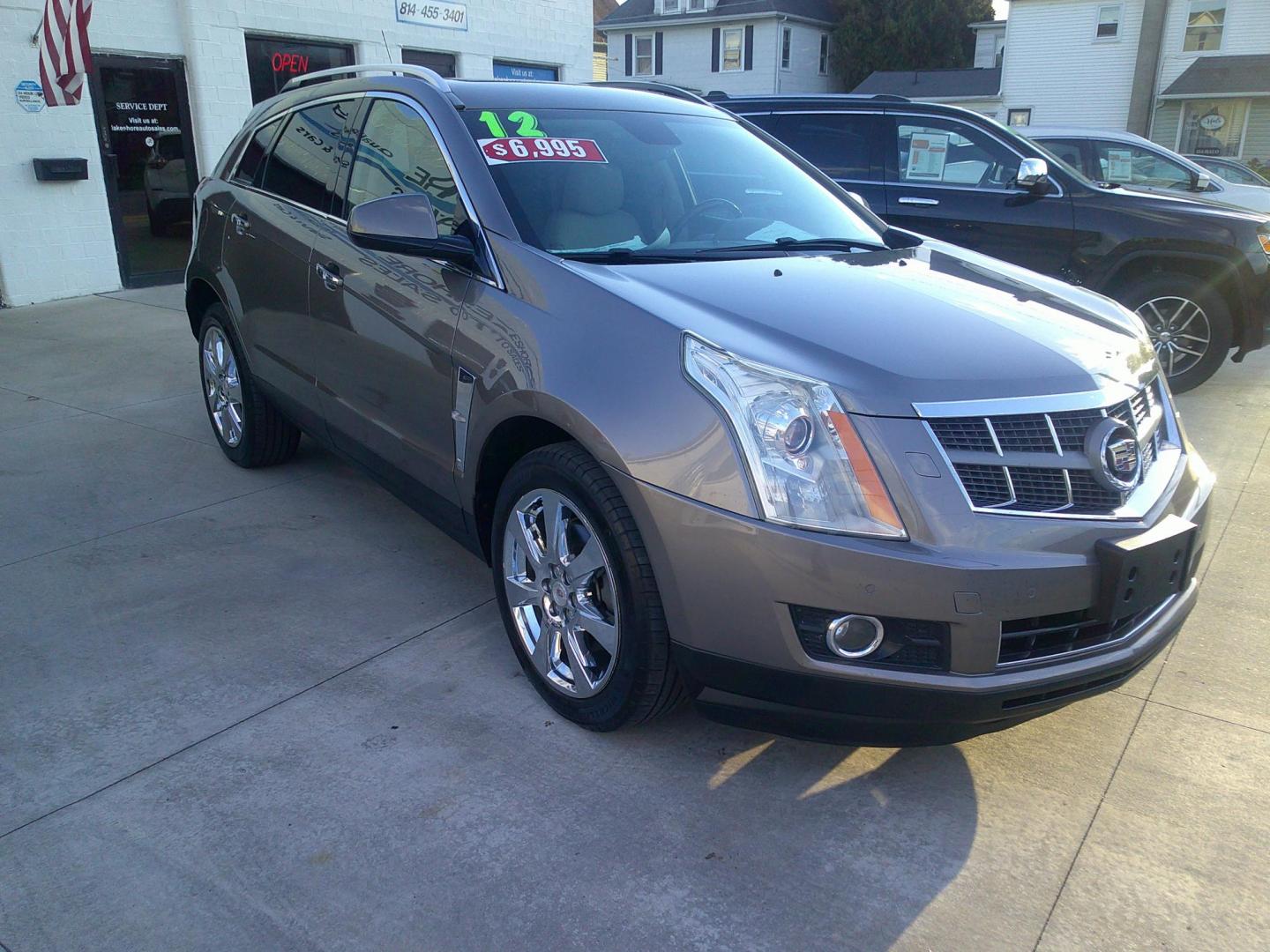 2012 Mocha Steel Metallic /Shale W / Brownstone Cadillac SRX Performance (3GYFNEE30CS) with an 3.6L V6 DOHC 24V FFV engine, 6-Speed Automatic transmission, located at 827 W 26th Street, Erie, PA, 16508, (814) 455-3401, 42.105431, -80.090942 - Thanks for looking at our two-owner accident-free recent trade in by a long-time customer who took great care of it. This is the Performance model with all wheel drive, and most all factory options. a full service was just completed in our service department with new Pa state and emissions inspectio - Photo#0