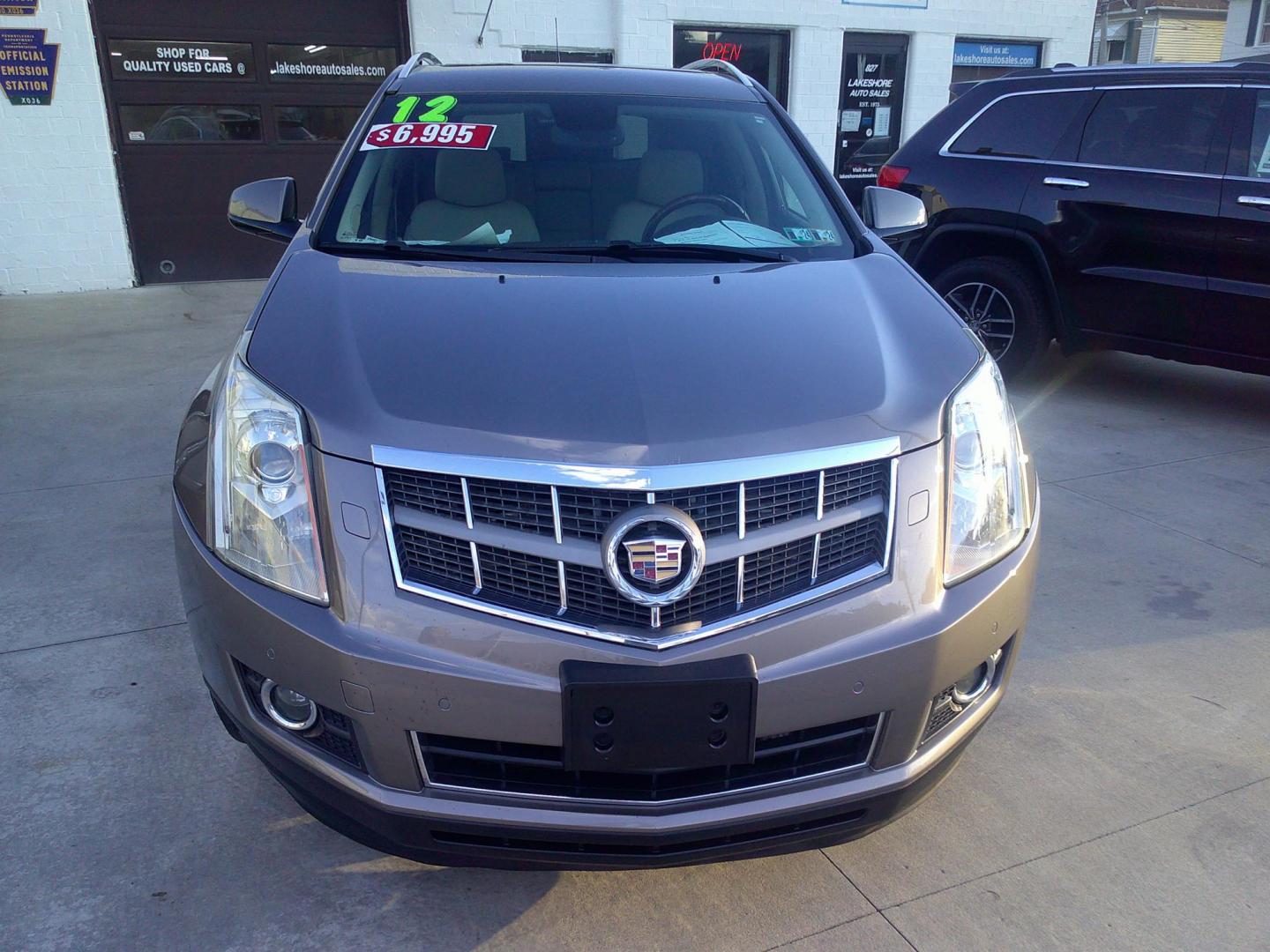 2012 Mocha Steel Metallic /Shale W / Brownstone Cadillac SRX Performance (3GYFNEE30CS) with an 3.6L V6 DOHC 24V FFV engine, 6-Speed Automatic transmission, located at 827 W 26th Street, Erie, PA, 16508, (814) 455-3401, 42.105431, -80.090942 - Thanks for looking at our two-owner accident-free recent trade in by a long-time customer who took great care of it. This is the Performance model with all wheel drive, and most all factory options. a full service was just completed in our service department with new Pa state and emissions inspectio - Photo#1