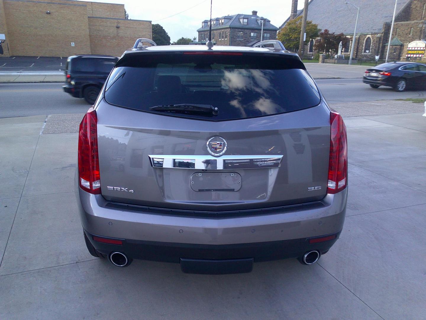 2012 Mocha Steel Metallic /Shale W / Brownstone Cadillac SRX Performance (3GYFNEE30CS) with an 3.6L V6 DOHC 24V FFV engine, 6-Speed Automatic transmission, located at 827 W 26th Street, Erie, PA, 16508, (814) 455-3401, 42.105431, -80.090942 - Thanks for looking at our two-owner accident-free recent trade in by a long-time customer who took great care of it. This is the Performance model with all wheel drive, and most all factory options. a full service was just completed in our service department with new Pa state and emissions inspectio - Photo#5