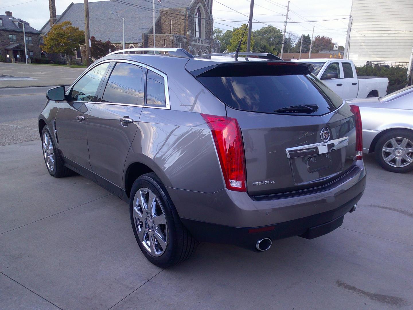 2012 Mocha Steel Metallic /Shale W / Brownstone Cadillac SRX Performance (3GYFNEE30CS) with an 3.6L V6 DOHC 24V FFV engine, 6-Speed Automatic transmission, located at 827 W 26th Street, Erie, PA, 16508, (814) 455-3401, 42.105431, -80.090942 - Thanks for looking at our two-owner accident-free recent trade in by a long-time customer who took great care of it. This is the Performance model with all wheel drive, and most all factory options. a full service was just completed in our service department with new Pa state and emissions inspectio - Photo#6