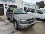 2009 Graystone Metallic /Graphite Chevrolet TrailBlazer LT 4WD (1GNDT33SX92) with an 4.2L L6 DOHC 24V engine, 4-Speed Automatic transmission, located at 827 W 26th Street, Erie, PA, 16508, (814) 455-3401, 42.105431, -80.090942 - Thanks for looking at our super low mileage accident-free new Chevy trade. This is the LT model with four-wheel drive, power sunroof and drivers seat, trailer tow package, both keys and remotes, the factory window sticker, the owner's manuals plus it comes with Weathertech floor mats and the factory - Photo#0