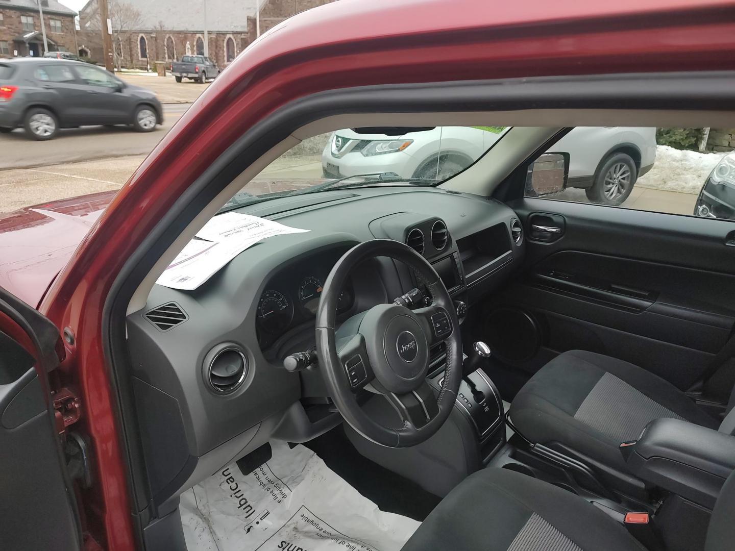 2014 Deep cherry Red Cyrstal Pearl Coat /Graphite Jeep Patriot Latitude 4WD (1C4NJRFB1ED) with an 2.4L L4 DOHC 16V engine, 4-Speed Automatic transmission, located at 827 W 26th Street, Erie, PA, 16508, (814) 455-3401, 42.105431, -80.090942 - Thanks for looking at our low mileage rust and accident-free new Jeep trade. This is the Latitude model with four-wheel drive, heated seats and lots more including a rust-free exterior as well as a like new nonsmoker interior. A full service was just done in our service department with new Pa state - Photo#9