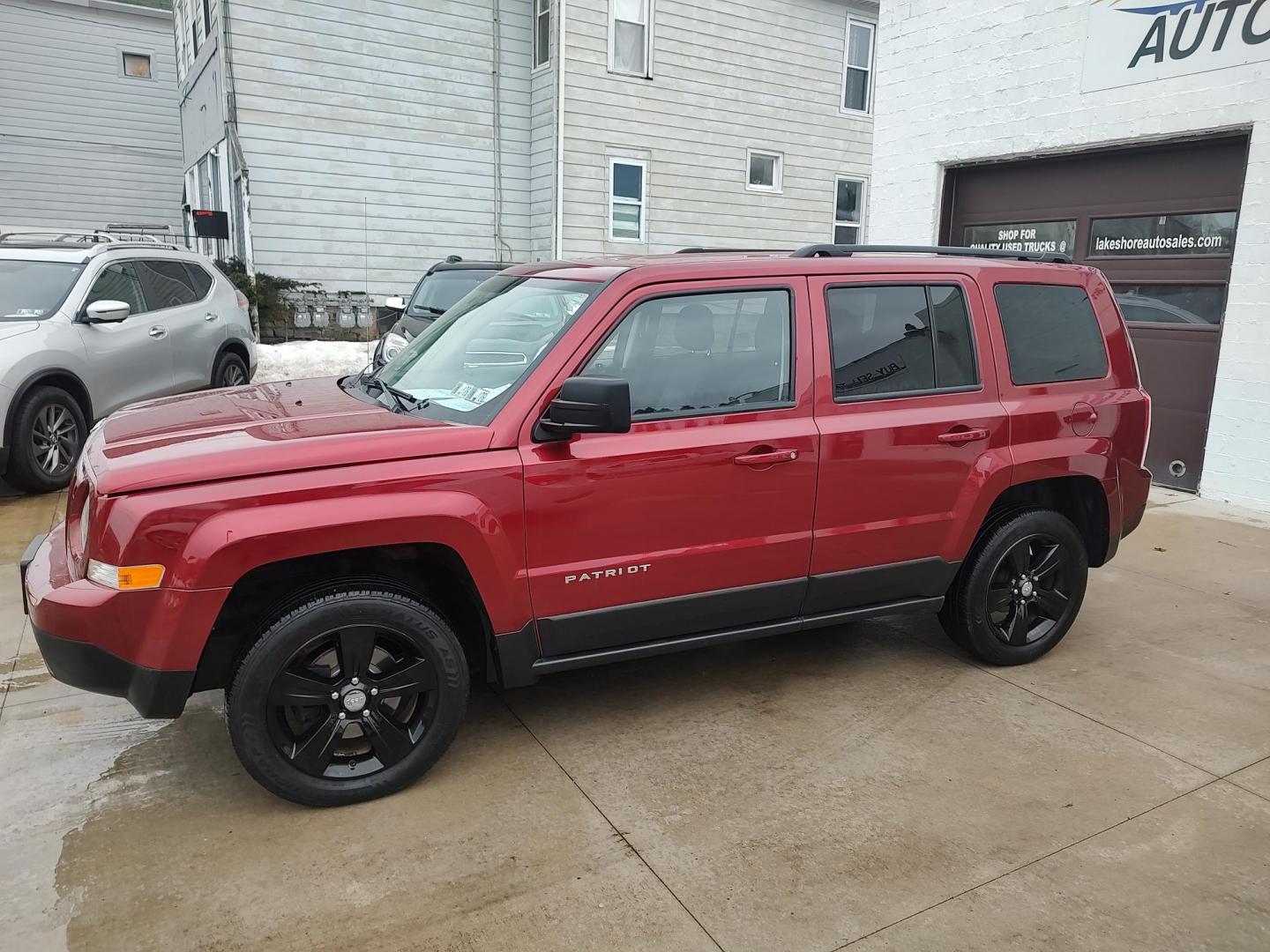 2014 Deep cherry Red Cyrstal Pearl Coat /Graphite Jeep Patriot Latitude 4WD (1C4NJRFB1ED) with an 2.4L L4 DOHC 16V engine, 4-Speed Automatic transmission, located at 827 W 26th Street, Erie, PA, 16508, (814) 455-3401, 42.105431, -80.090942 - Thanks for looking at our low mileage rust and accident-free new Jeep trade. This is the Latitude model with four-wheel drive, heated seats and lots more including a rust-free exterior as well as a like new nonsmoker interior. A full service was just done in our service department with new Pa state - Photo#7