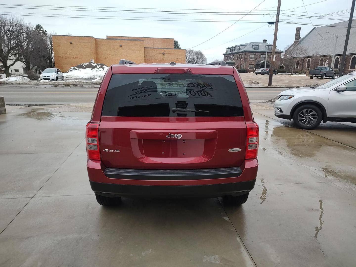 2014 Deep cherry Red Cyrstal Pearl Coat /Graphite Jeep Patriot Latitude 4WD (1C4NJRFB1ED) with an 2.4L L4 DOHC 16V engine, 4-Speed Automatic transmission, located at 827 W 26th Street, Erie, PA, 16508, (814) 455-3401, 42.105431, -80.090942 - Thanks for looking at our low mileage rust and accident-free new Jeep trade. This is the Latitude model with four-wheel drive, heated seats and lots more including a rust-free exterior as well as a like new nonsmoker interior. A full service was just done in our service department with new Pa state - Photo#3