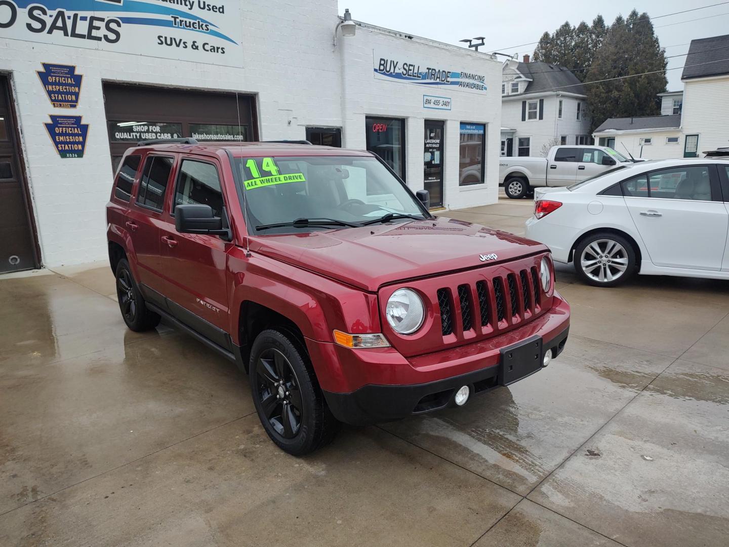 2014 Deep cherry Red Cyrstal Pearl Coat /Graphite Jeep Patriot Latitude 4WD (1C4NJRFB1ED) with an 2.4L L4 DOHC 16V engine, 4-Speed Automatic transmission, located at 827 W 26th Street, Erie, PA, 16508, (814) 455-3401, 42.105431, -80.090942 - Thanks for looking at our low mileage rust and accident-free new Jeep trade. This is the Latitude model with four-wheel drive, heated seats and lots more including a rust-free exterior as well as a like new nonsmoker interior. A full service was just done in our service department with new Pa state - Photo#0