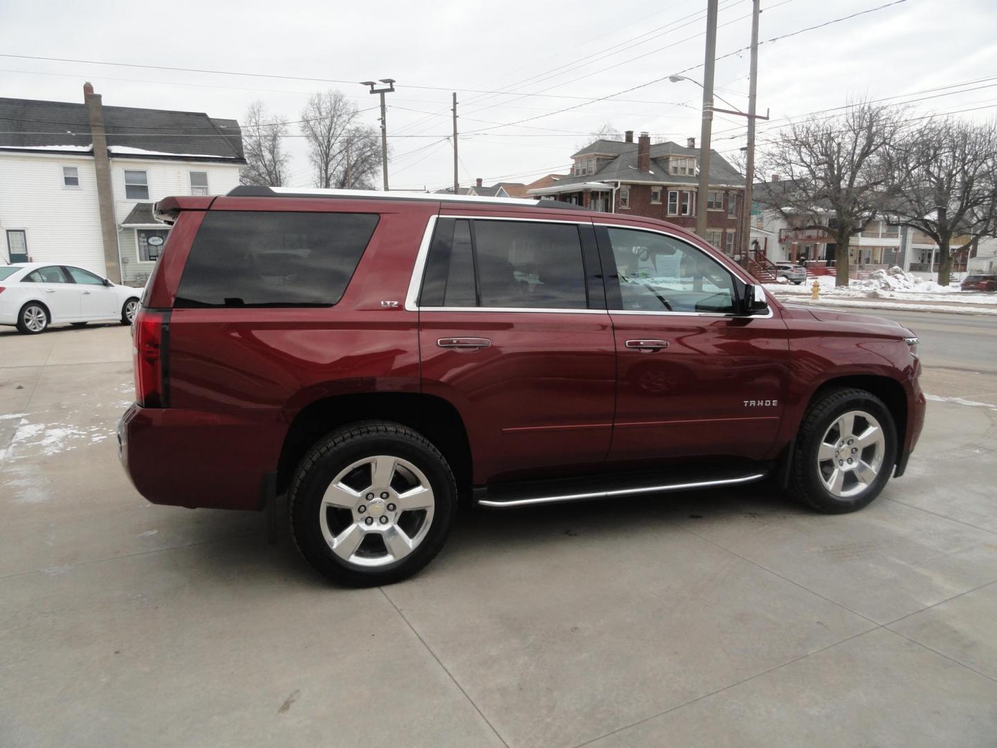 2016 Limited Addiction Red /Coco/Dune Chevrolet Tahoe LTZ 4WD (1GNSKCKC0GR) with an 5.3L V8 OHV 16V engine, 6-Speed Automatic transmission, located at 827 W 26th Street, Erie, PA, 16508, (814) 455-3401, 42.105431, -80.090942 - Thanks for looking at our super clean rust and accident-free new GMC trade. This is the LTZ top of the line model for the 2016 model year, which comes with lots of options including heated and cooled leather front seats, heated second row buckets, power sunroof, passive entry, power sunroof, power t - Photo#3