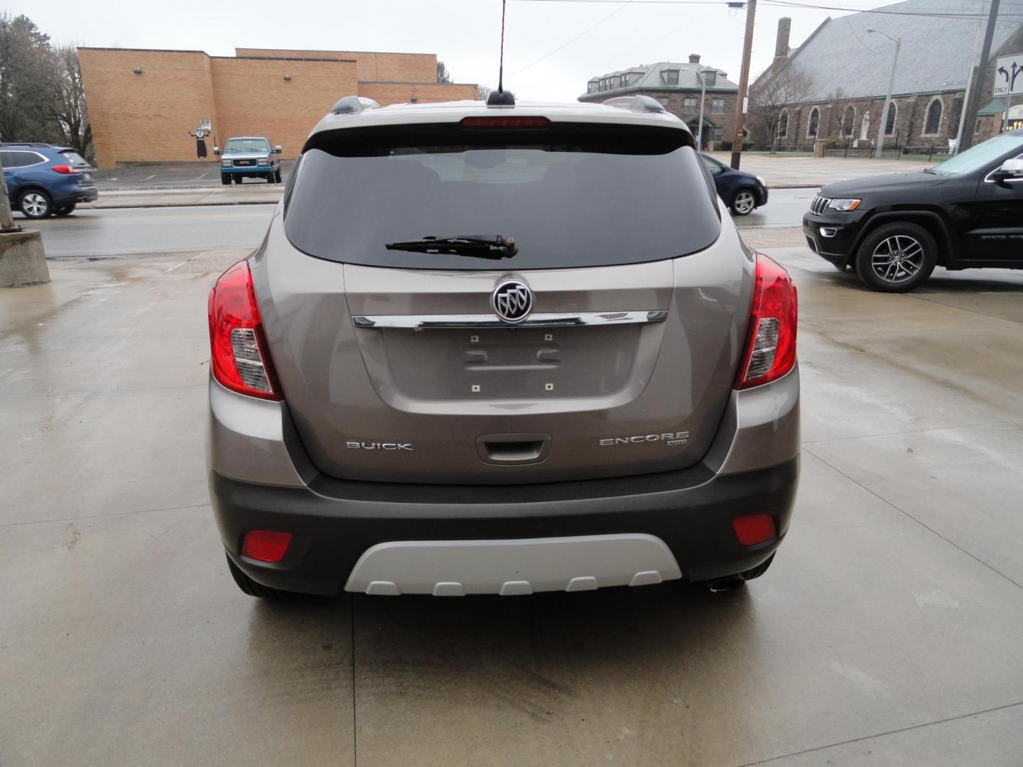 2015 Sandy Beach Metallic /Coco Dune Buick Encore Leather AWD (KL4CJGSBXFB) with an 1.4L L4 DOHC 16V TURBO engine, 6-Speed Automatic transmission, located at 827 W 26th Street, Erie, PA, 16508, (814) 455-3401, 42.105431, -80.090942 - Photo#4